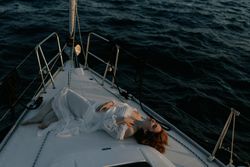 Woman in luxury dress resting on yacht