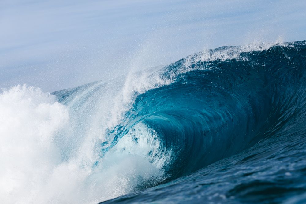 Ocean waves under blue sky
