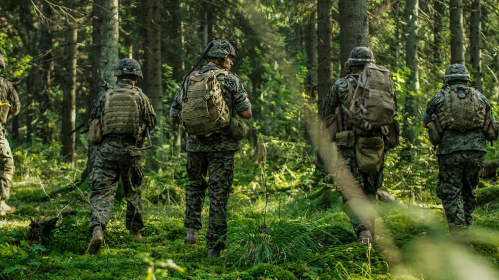 Squad of Five Fully Equipped Soldiers in Camouflage on a Reconnaissance Military Mission
