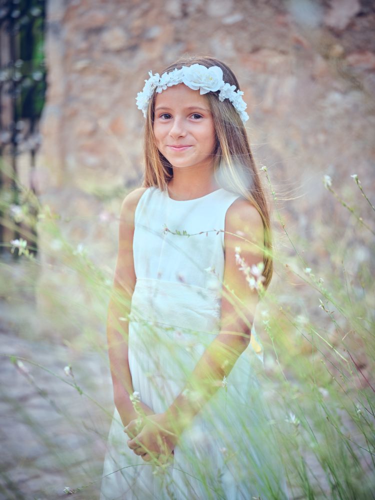Charming girl in flower wreath