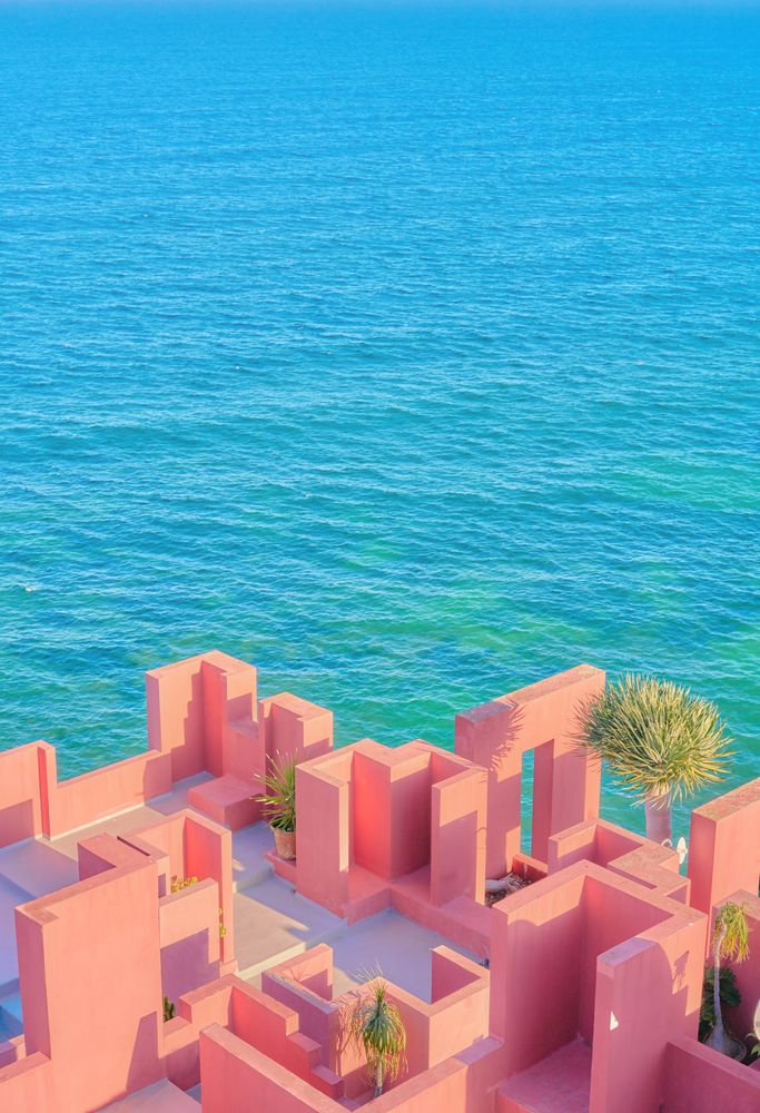 Pink wall construction against blue sea