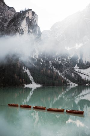Beautiful lake with boast with mountains behind