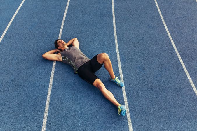 Sprinter relaxing on the running track