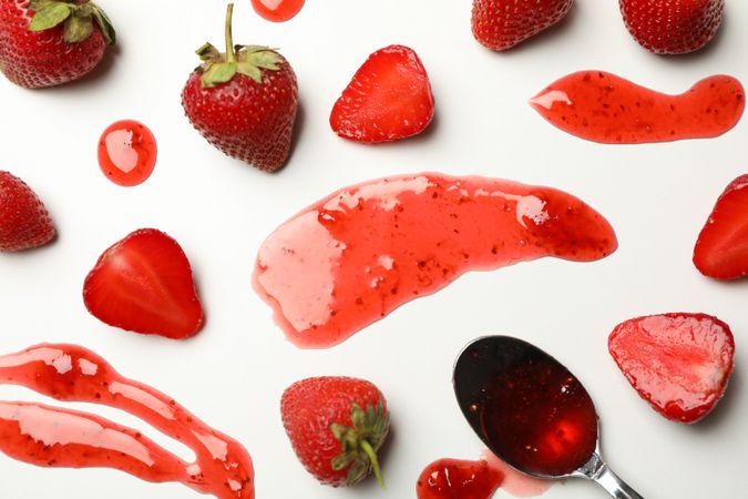 Composition with strawberry and jam on blank background