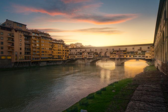 Old bridge across channel in sunset