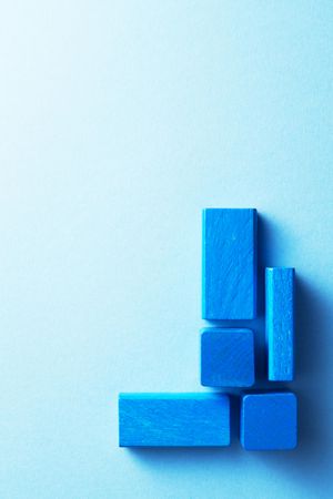 Blue wooden blocks in the corner of composition