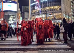 Japan - Tokyo, Shibuya Japan - November 29th, 2019: Red Rebel Brigade kneeling on crosswalk 0LdXV0