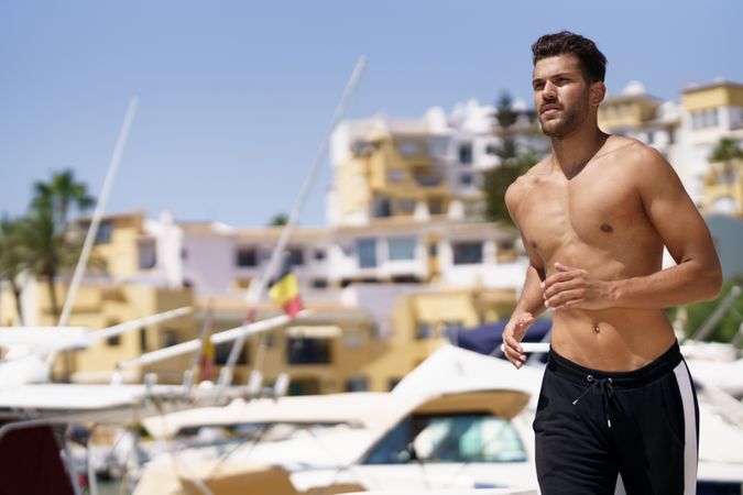 Male exercising on waterfront