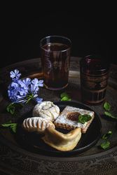 Traditional tea with mint and assorted Arab sweets