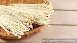 Bamboo basket of fresh golden needle mushrooms 5zOej4