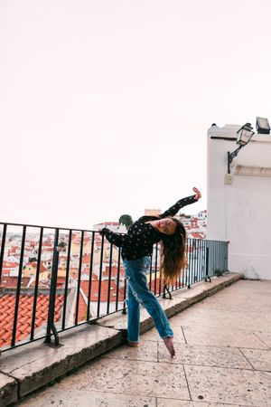 dancer dancing against cityscape