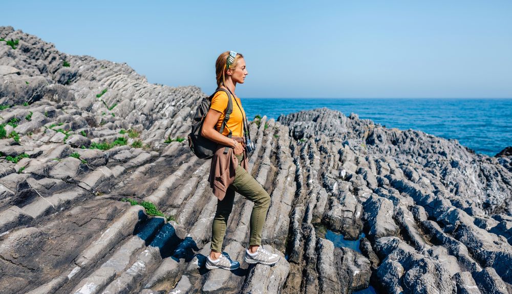 Woman enjoying view on an ocean hike