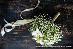 Bridal bouquet of gypsophila paniculata flowers on wooden table 0JGVOw