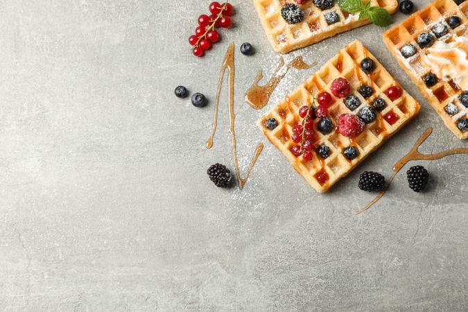 Flat lay composition with sweet belgian waffles, space for text