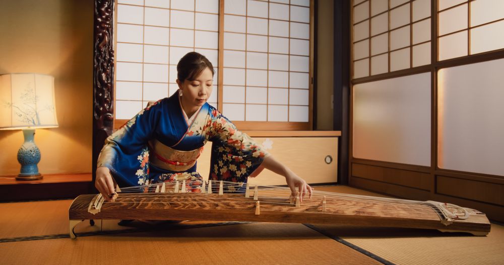 Musician Wearing a Blue Kimono, Practicing to Play Historic Music Before a Concert