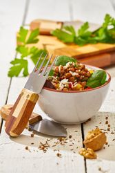 Bright vegetables with lentils and spinach in bowl