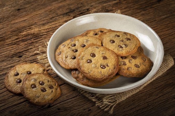 Delicious chocolate cookies on wooden table.