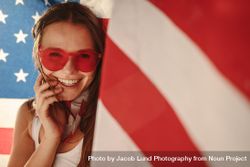 Cheerful American woman with national flag 4BOO3b