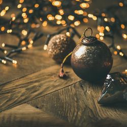 Christmas tree decorations, on wooden counter, close up, copy space, square crop