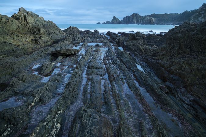 Foggy landscape of Playa de Gueirua rock seashore