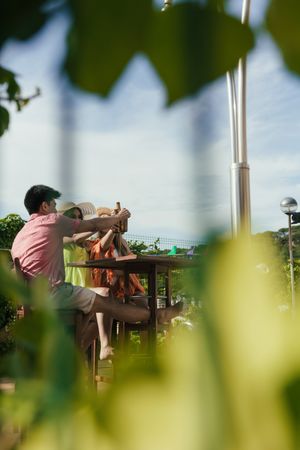 Group of friends drinking beer on the terrace