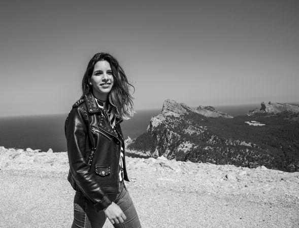 Smiling female on seashore