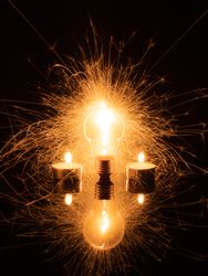 Sparkling light bulb and candles