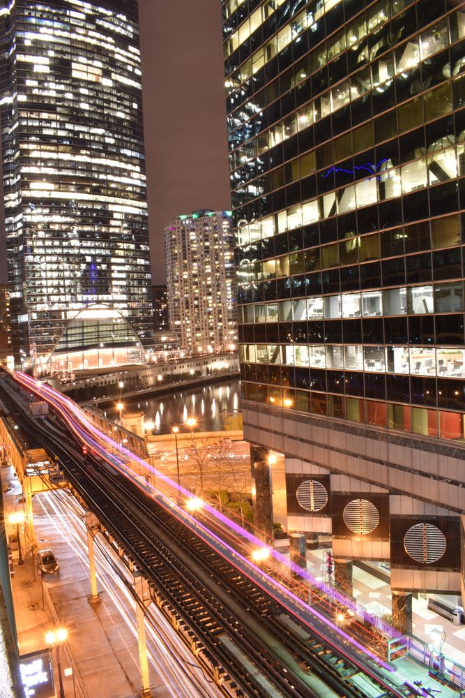 Cars on road in city during night time