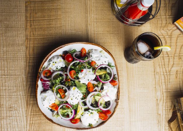 Vegetables salad with onion greens and cream sauce