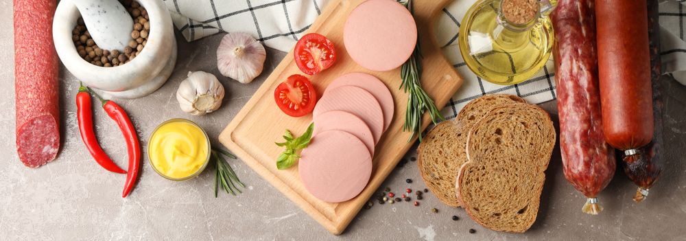 Banner of cured meats, bread, mustard and mortar