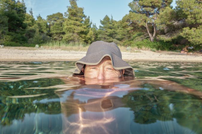 Man swimming under water in sea
