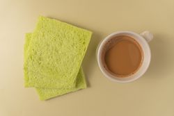 Soft pandan flavored bread and milk coffee