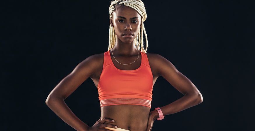 Portrait of a female athlete on a dark background