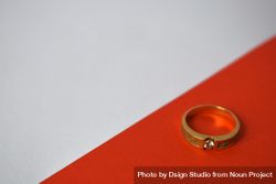 Man's diamond gold ring on duotone background with copy space 4d81pa