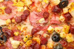 Tasty meat pizza on whole background, close up
