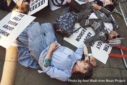 London, England, United Kingdom - September 15th,2019: Man and woman lying down at a protest 4BaEB5