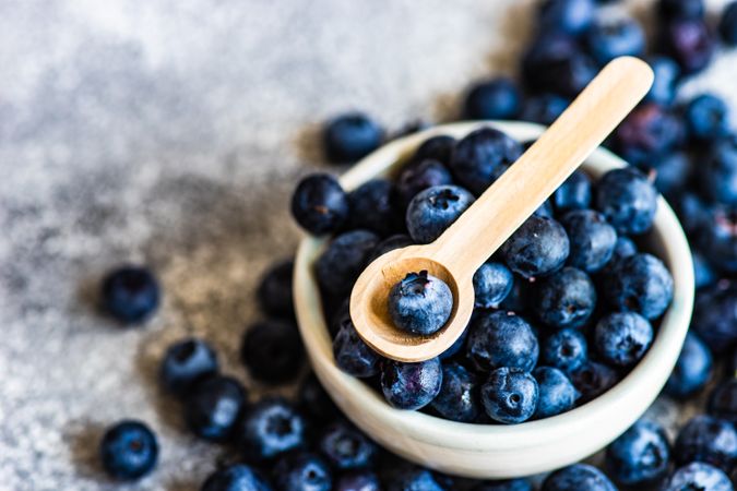 Organic blueberries on stone background