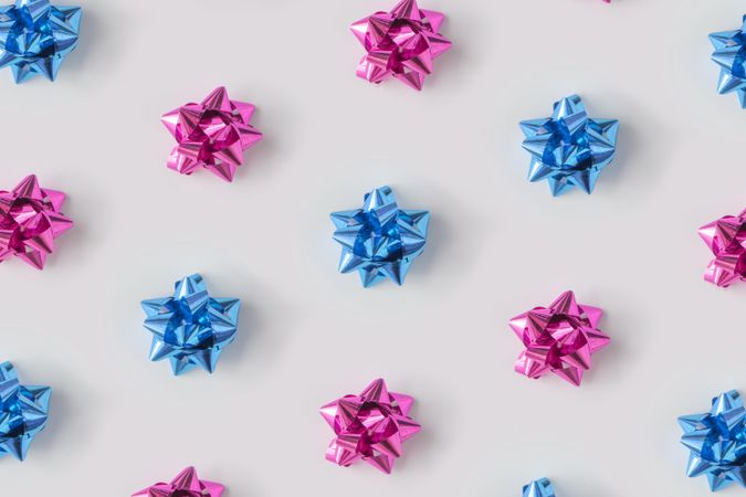 Pattern of plastic pink and blue decorative gift bows