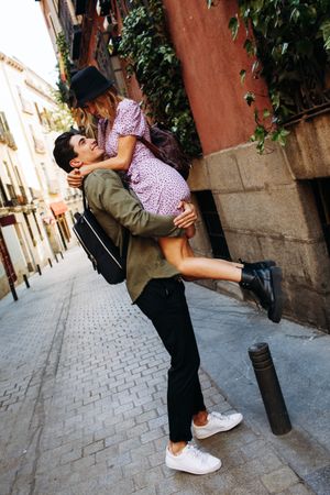 Happy couple having fun while walking in town