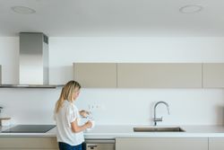 Woman making tea in kitchen