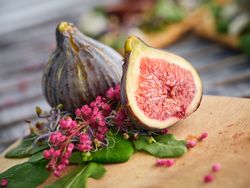 Fresh figs on wooden board