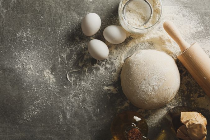 Concept for baking with dough on gray background
