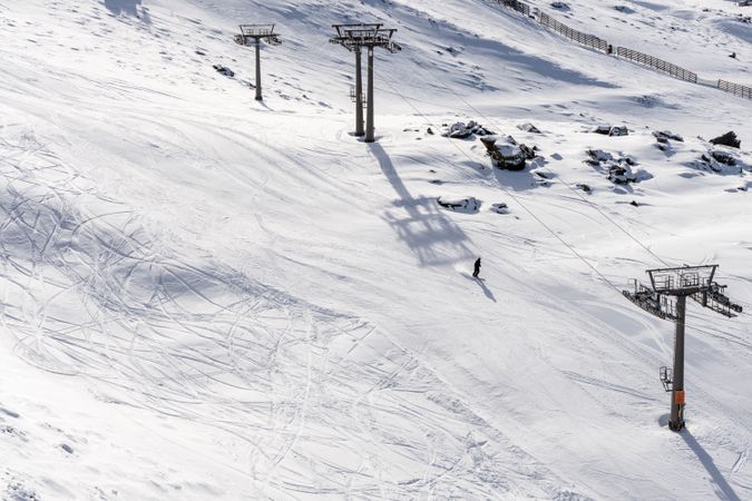 Single person skiing down mountain in Sierra Nevada resort