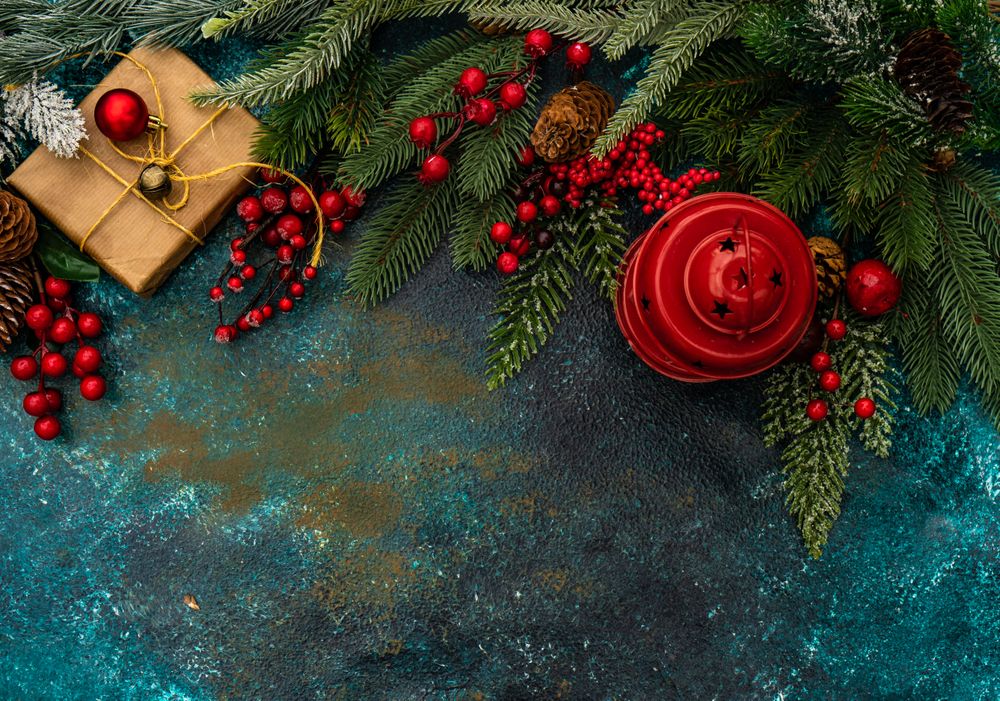 Top view of table with fir, berries, pine and Christmas gift and decorations