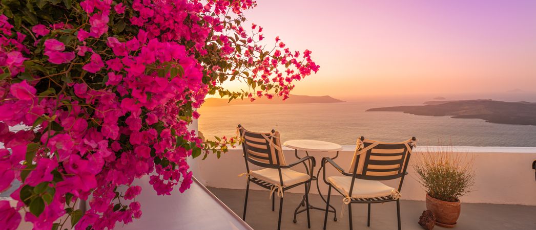Rooftop with two patio chairs looking out over Aegean Sea