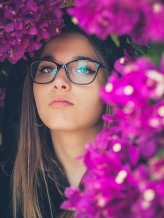 Woman on background of stunning violet flowers