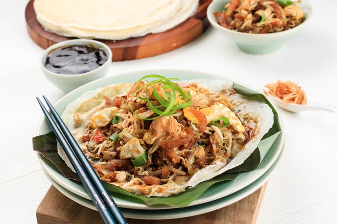 Popular Traditional Street Food Snack Made from Thin Wrapper with Saute Spicy Soy Bean Sprout and Bamboo Sprout, add with Sticky Sweet Paste from Starch