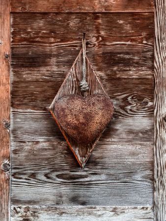 Rusty heart on chalet wood door