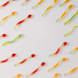 Colorful pattern made of gummy candies on bright background