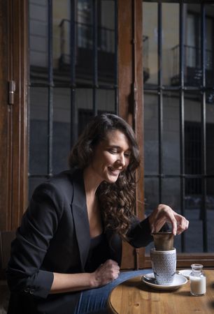 Young female with tea cup in cafe